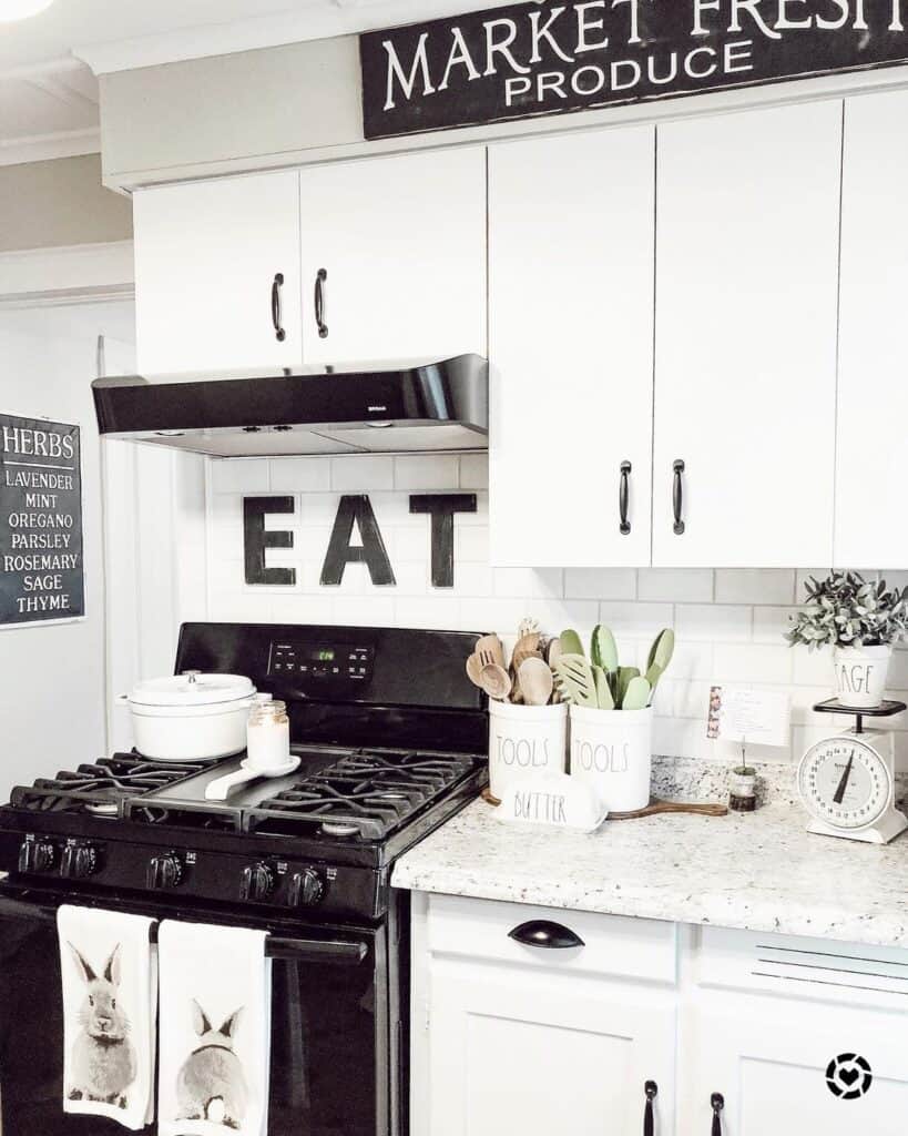 9 White Kitchens with Black Appliances for a Bold Splash of Contrast