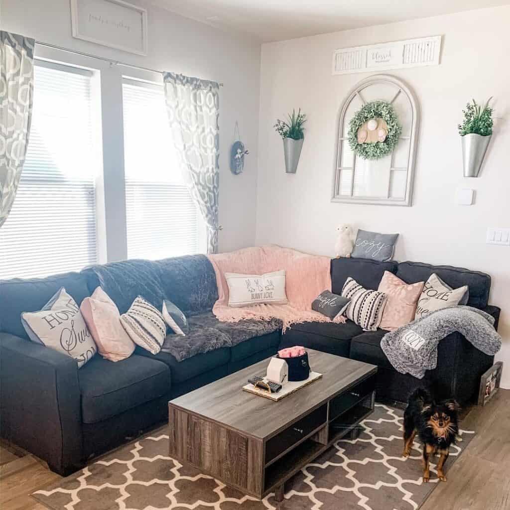 Farmhouse living room featuring dark gray sectional couch and wooden coffee table