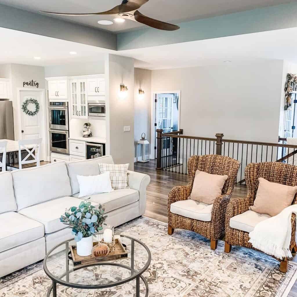 Living Room in Agreeable Gray by Sherwin-William with sectional couch and two armchairs.