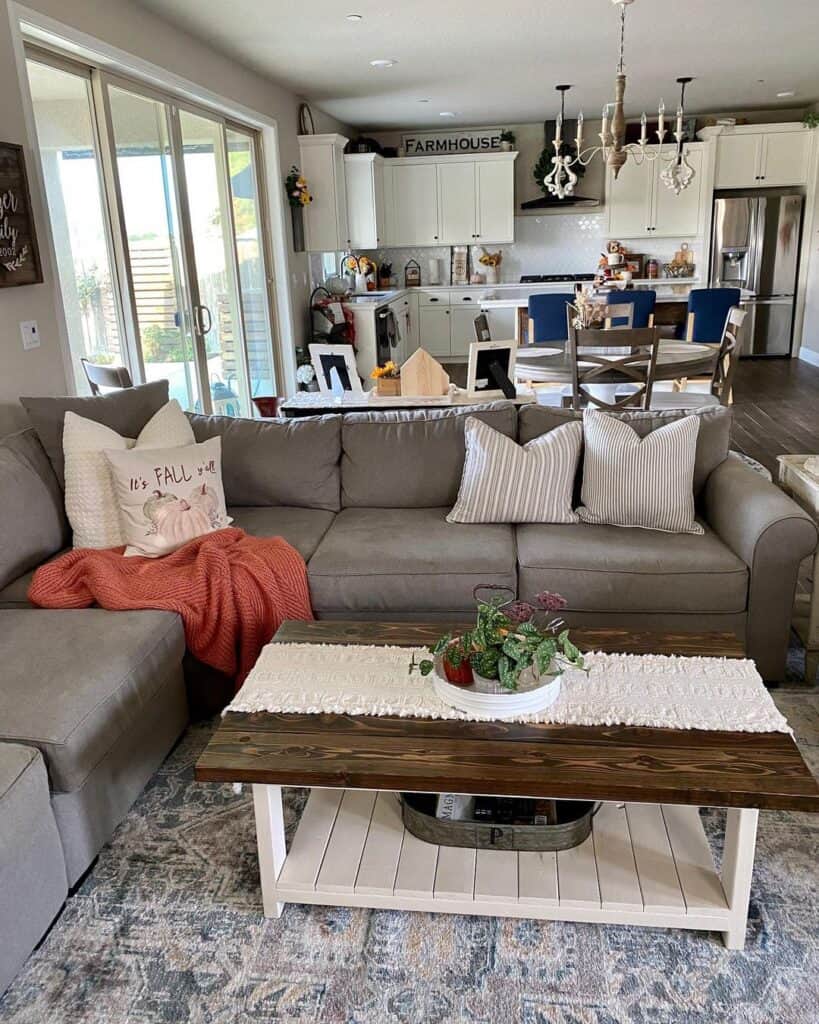 Rectangular coffee table and gray sectional in farmhouse living room
