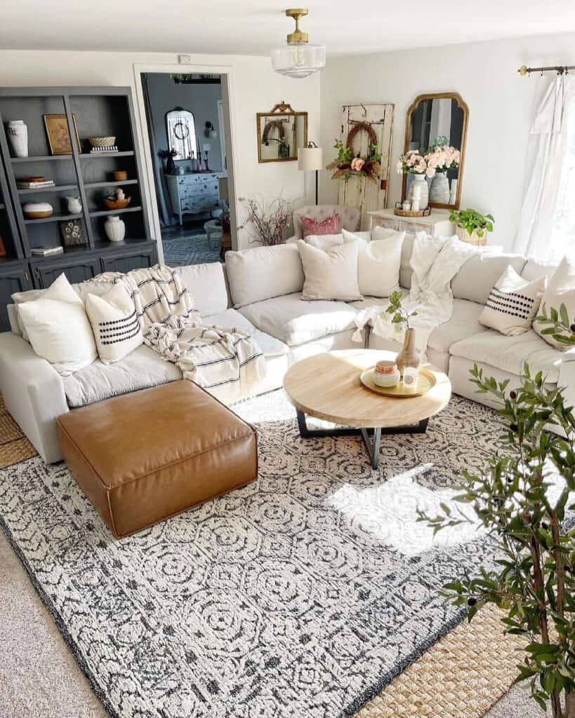 White Sectional with Brown Leather Ottoman