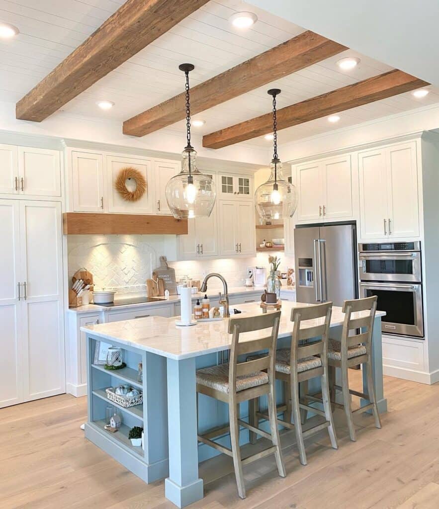 Farmhouse Kitchen With White Main Cabinetry and a Pastel Blue Island