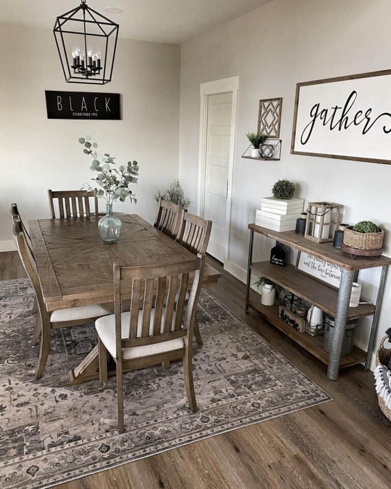 Farmhouse dining in Agreeable Gray by Sherwin-William with wooden table and chairs