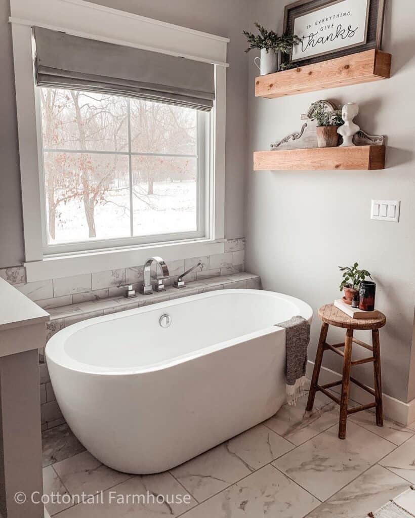 Gray and White Bathroom with Fall Window Scene