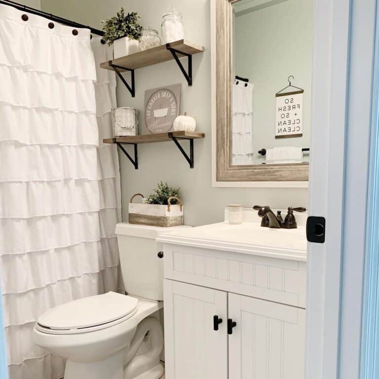 Bathtub with White Ruffled Shower Curtain