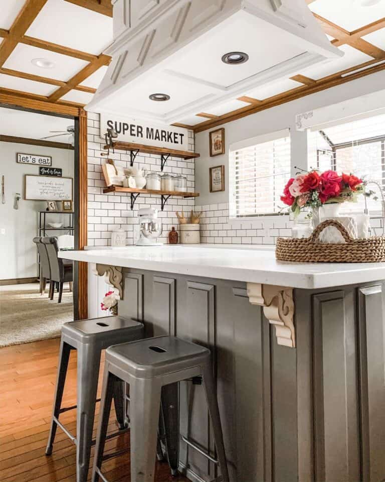 Beige Corbels on Gray Kitchen Island