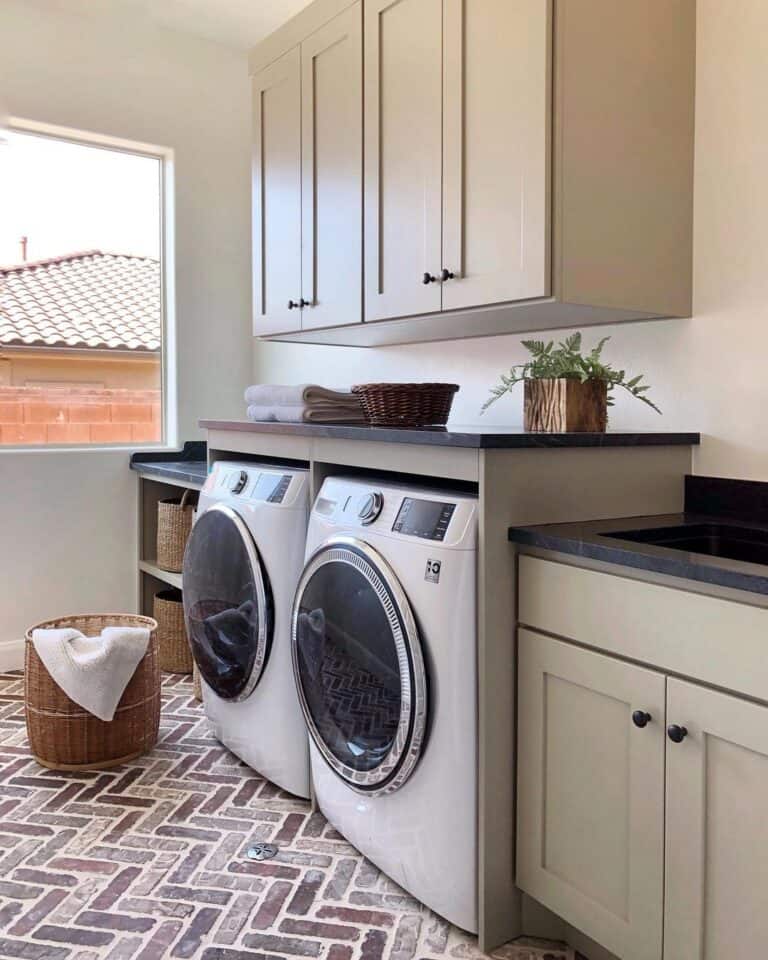 Beige Laundry Cabinets with Black Countertop