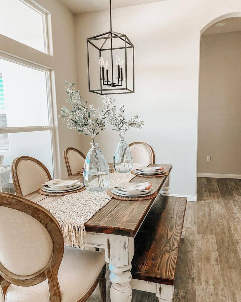 SW Agreeable Gray painted dining room with a farmhouse table and bench with chair