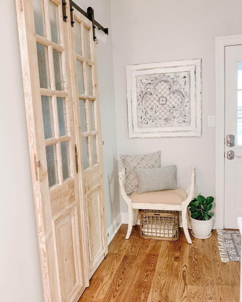 Farmhouse Entryway with Stained Wood Flooring