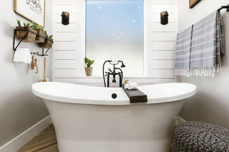 Freestanding Bathtub with Black Vintage Tub Filler