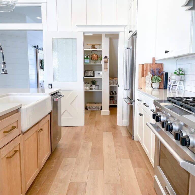 Light Wood Kitchen Island with Brass Hardware