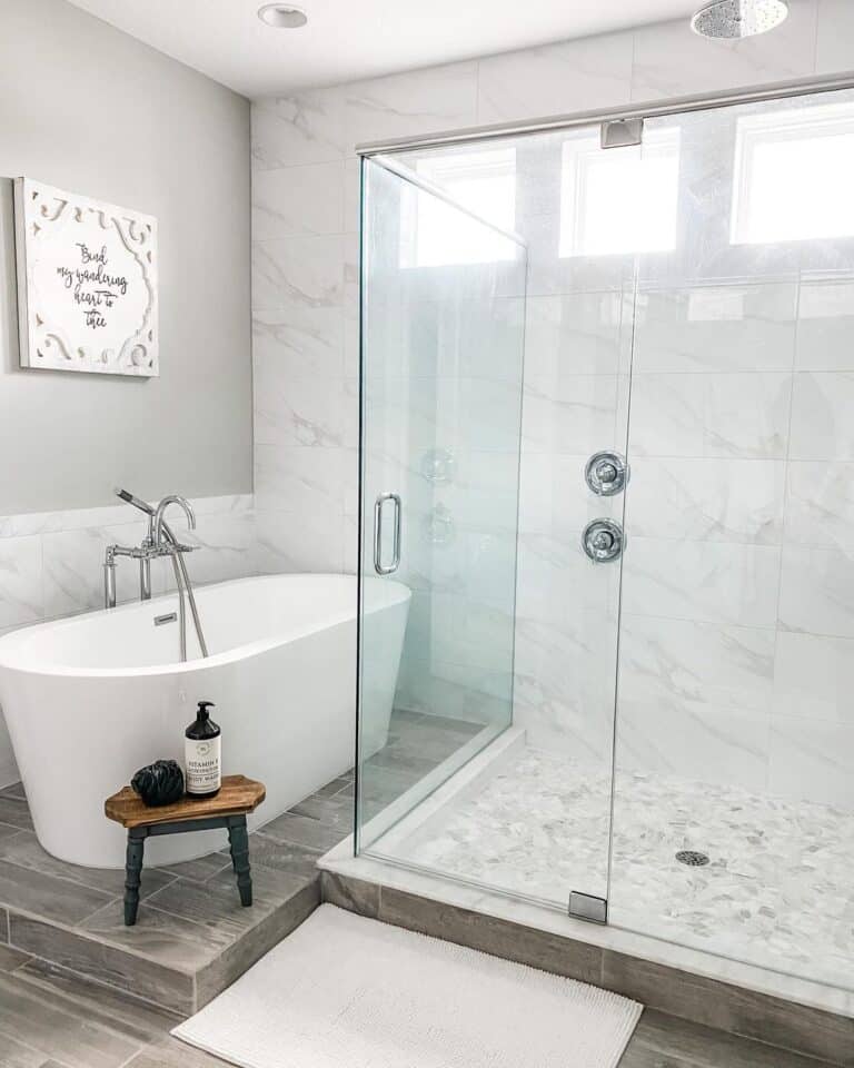 Oval Freestanding Bathtub on Gray Tile Platform Soul & Lane