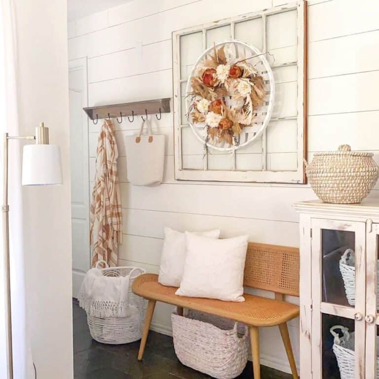 Rattan Bench with White Decorative Pillows
