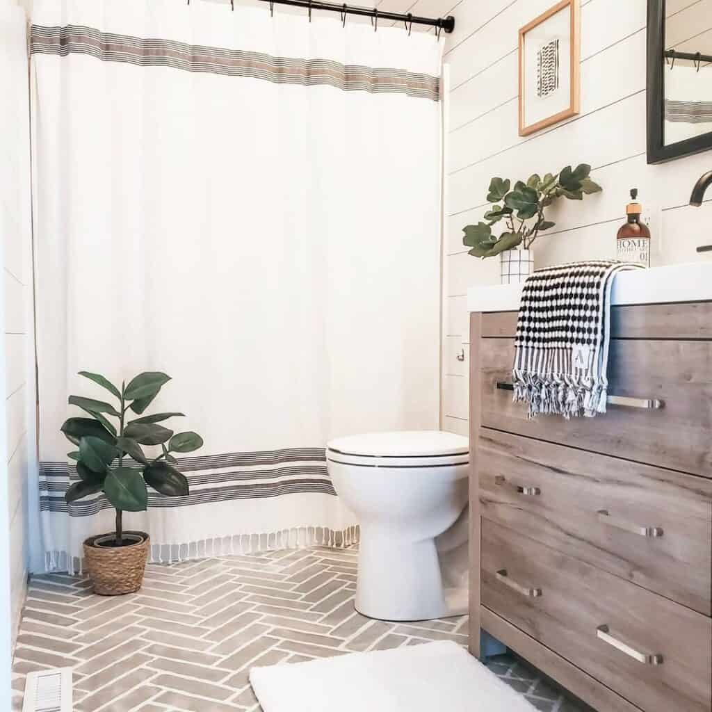 Bathroom with Beige Herringbone Floor Tiles