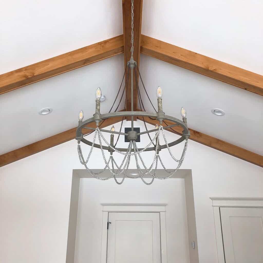 Vaulted Ceiling with Gray Wagon Wheel Chandelier