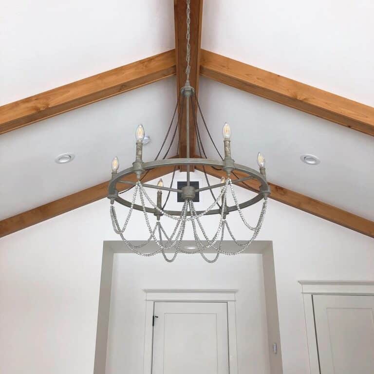 Vaulted Ceiling with Gray Wagon Wheel Chandelier