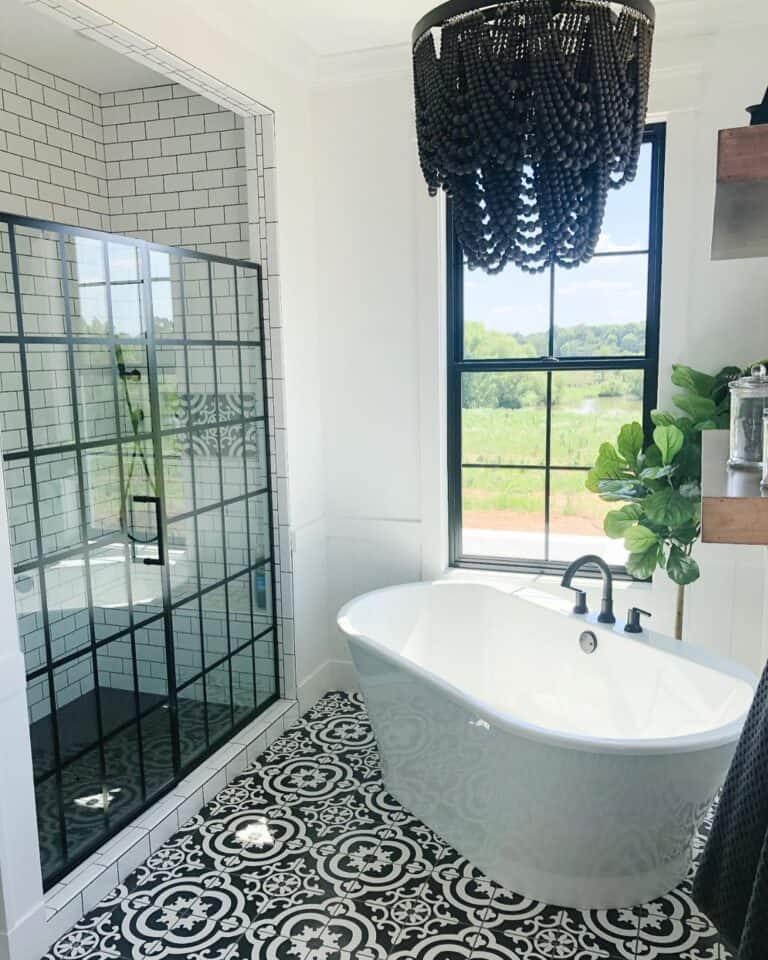 White Bathtub Next to Glass Shower