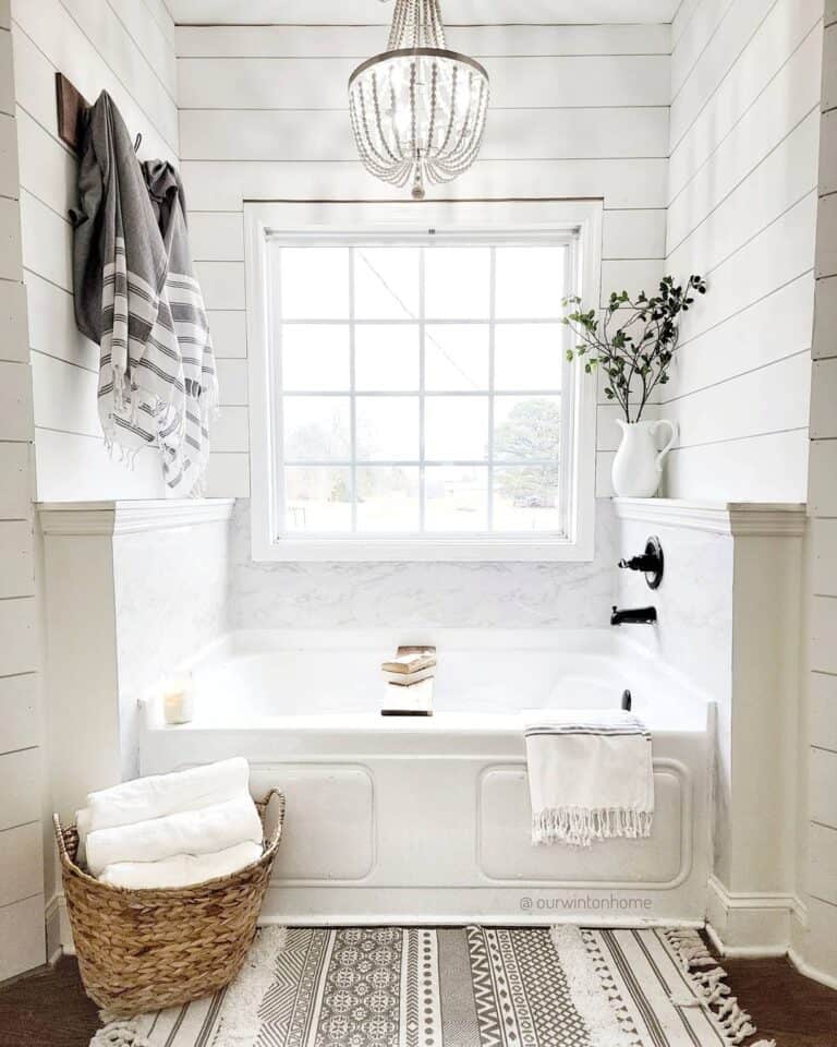 White Drop-in Tub with Black Faucet