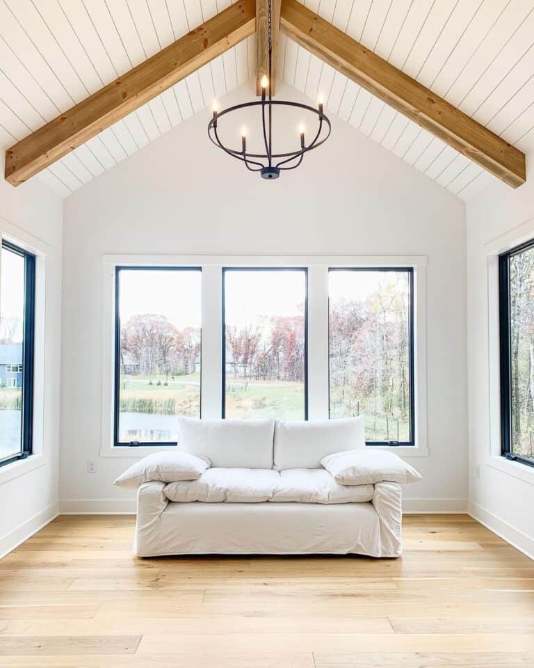 White Shiplap Ceiling with Black Chandelier