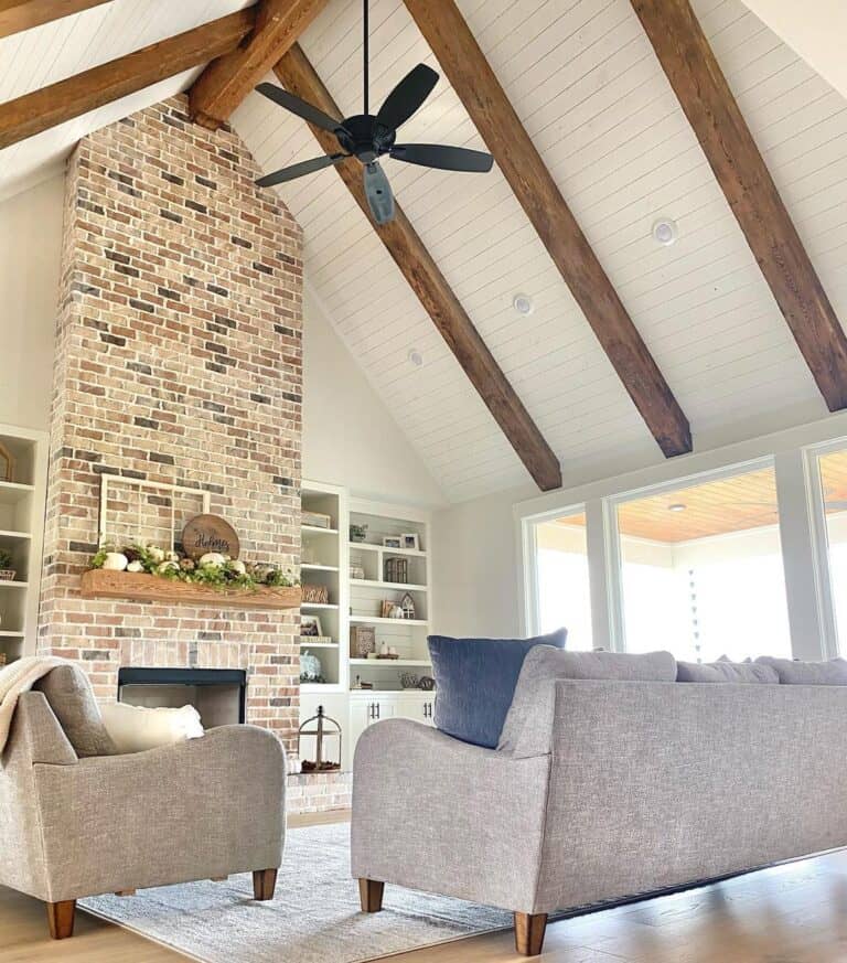 White Vaulted Shiplap Ceiling with Black Fan
