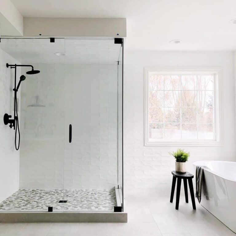 White Staggered Tile Shower with Glass Enclosure