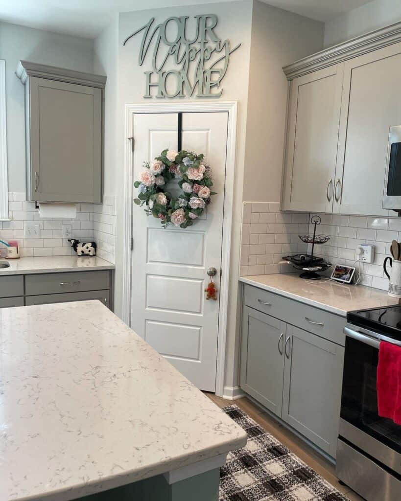 Gray Shaker Cabinets Paired With Subway Tile