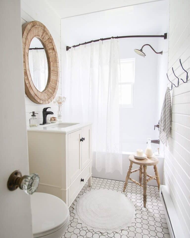 White Tub with Sheer White Shower Curtain