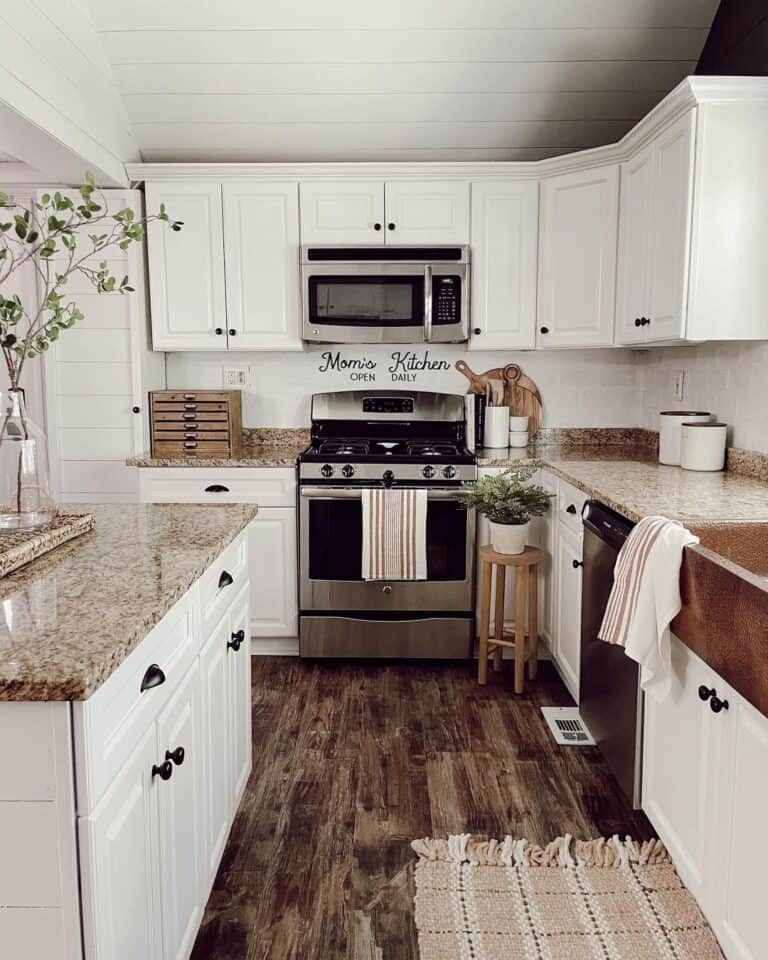 White Kitchen Cabinets with Crown Molding on Top and Brown Counters