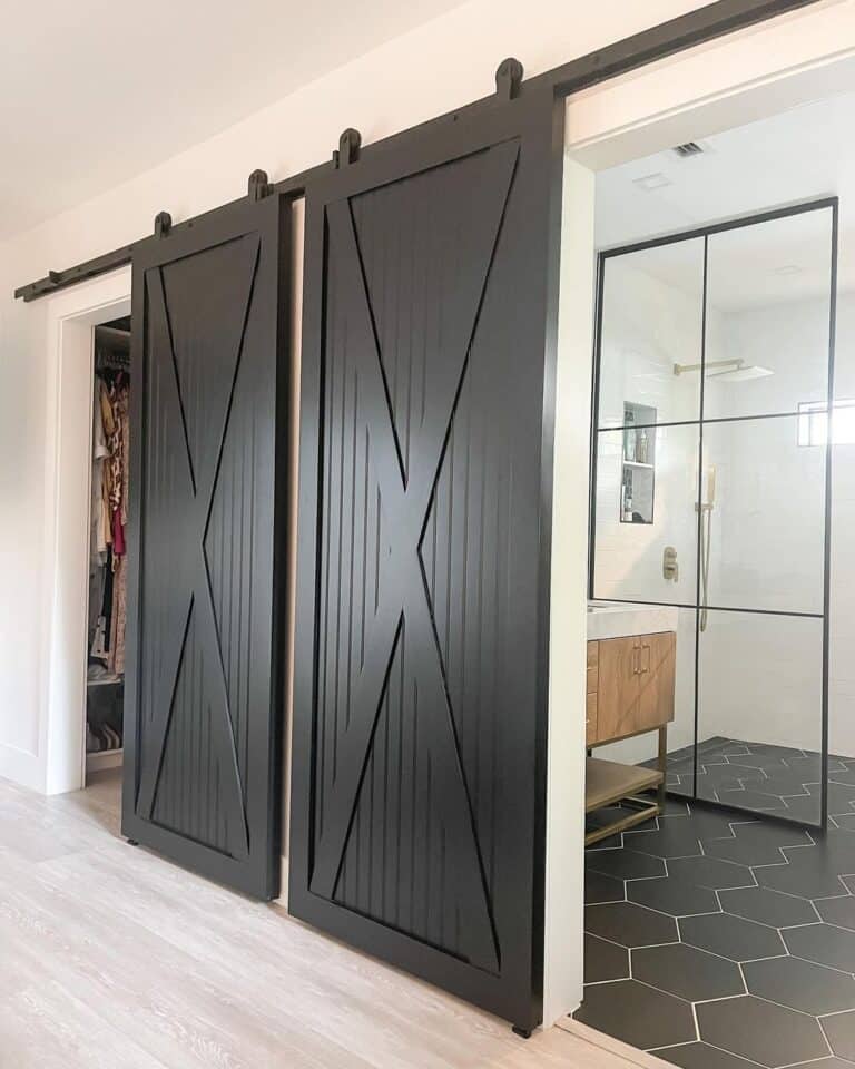 Bathroom with Glass Shower and Black Door