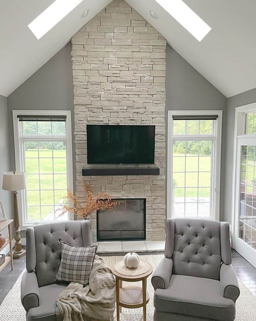 Beige Floor to Ceiling Stone Fireplace