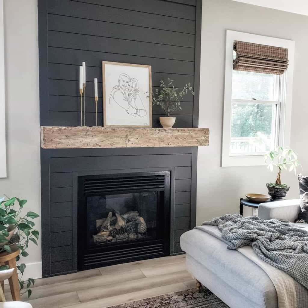 Black Shiplap Fireplace with Portrait Art Piece