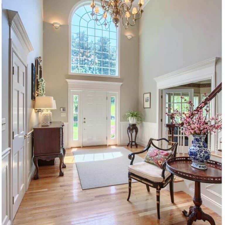 Brass and Beige Chandelier in Two-story Foyer