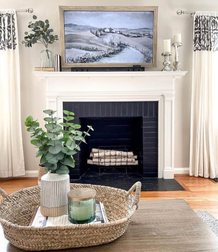 Gray Artwork Above White Fireplace Mantel