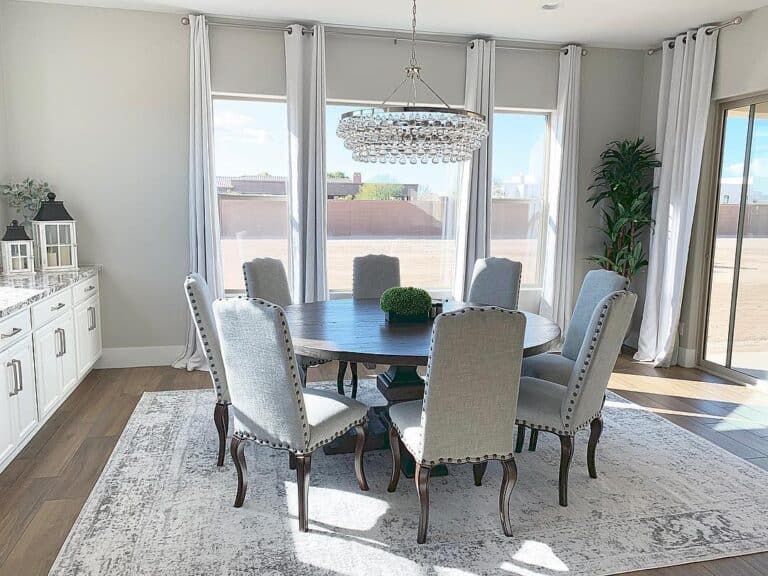 Gray Dining Room with Chrome and Crystal Chandelier