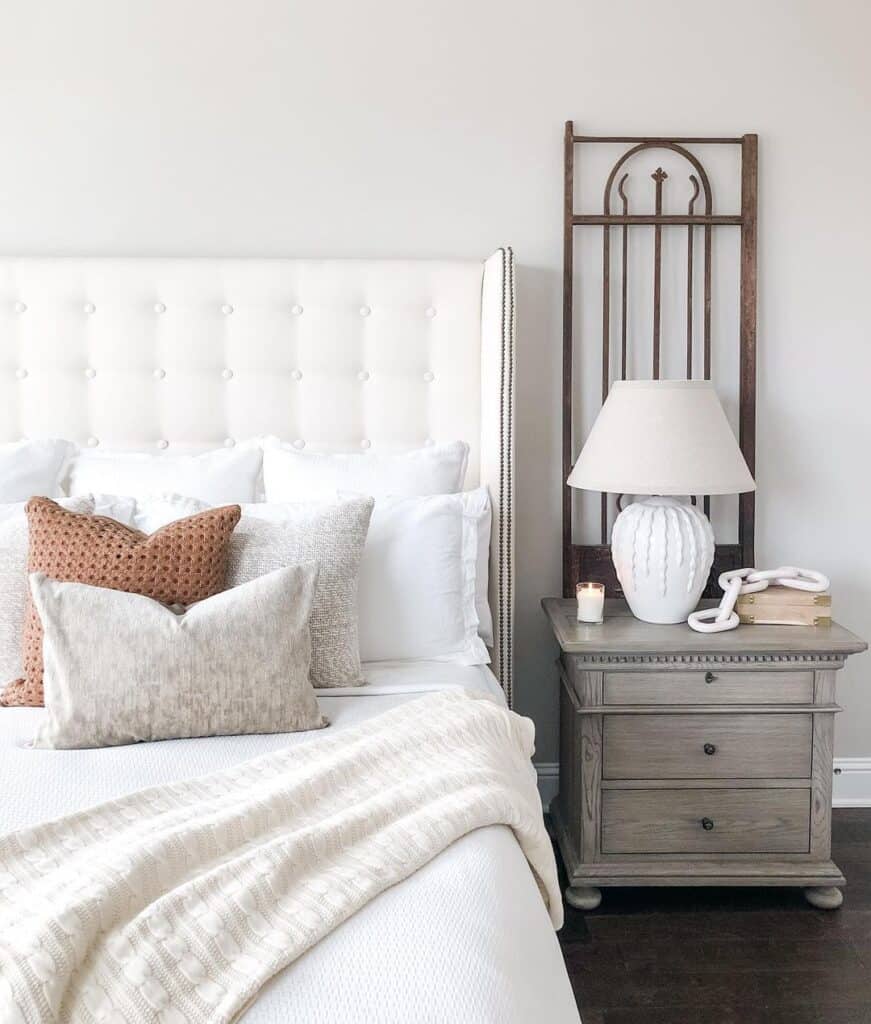 Ivory Tufted Bed with White Table Lamp