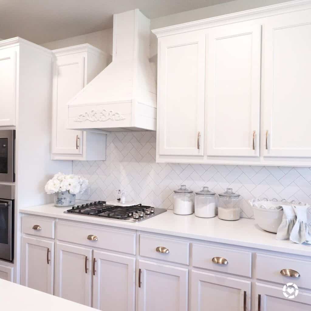 Kitchen Cabinets with White Herringbone Backsplash