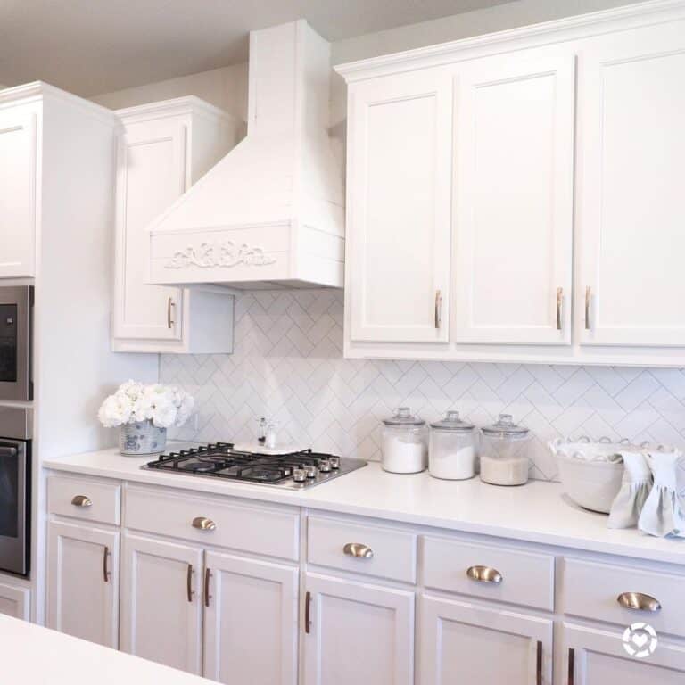 Kitchen Cabinets with White Herringbone Backsplash