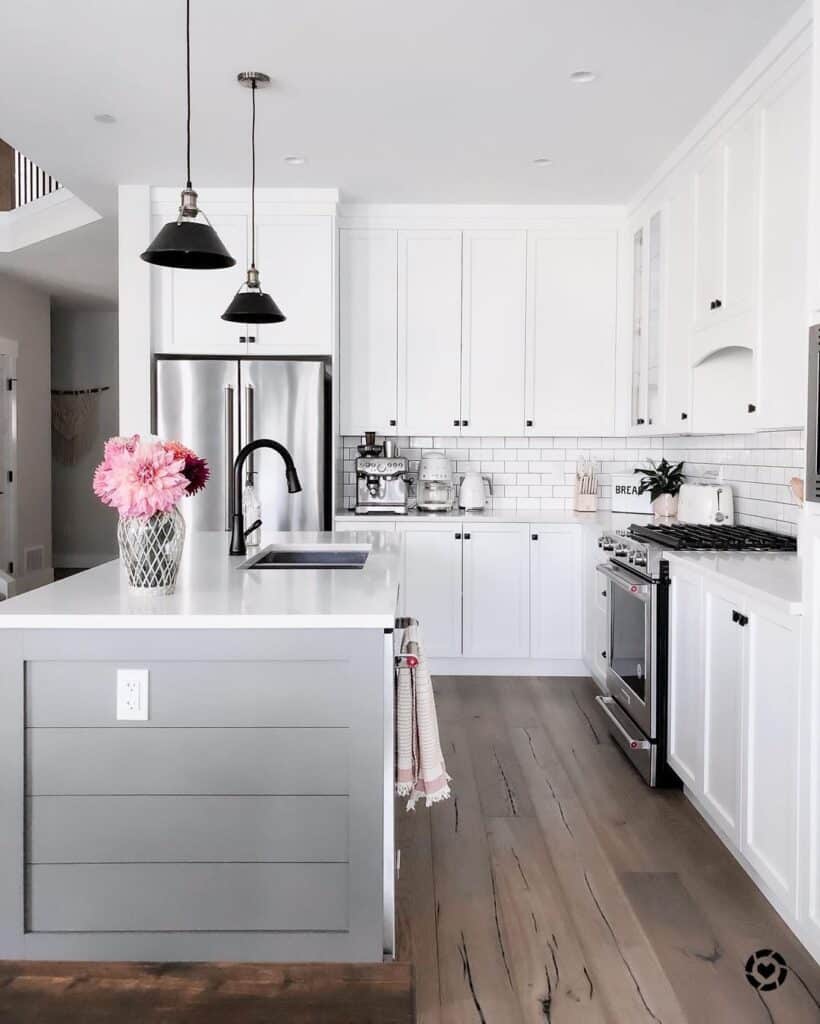 L-shaped White Kitchen Cabinets with White Countertops