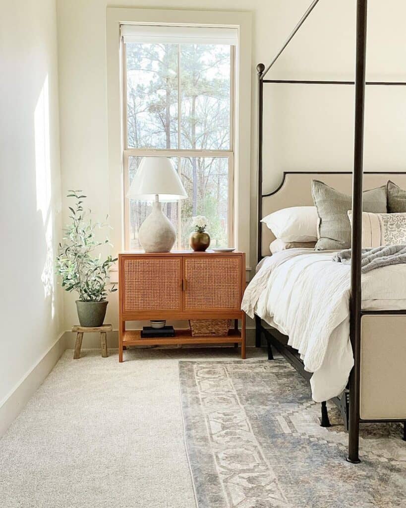 natural cream bedroom with black canopy bed - soul & lane