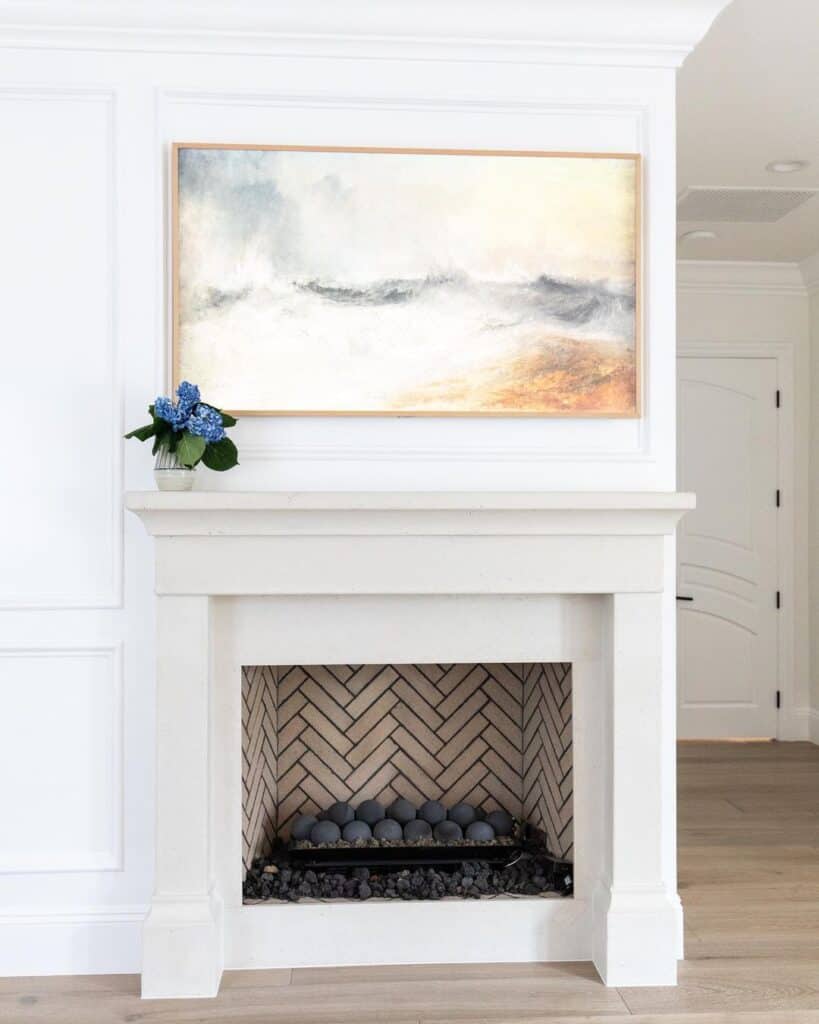 Light Wood Frame Abstract Art Above Fireplace