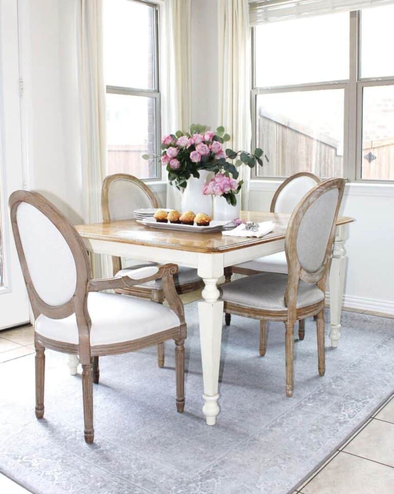 Two-toned White Dining Table on Pale Blue Rug