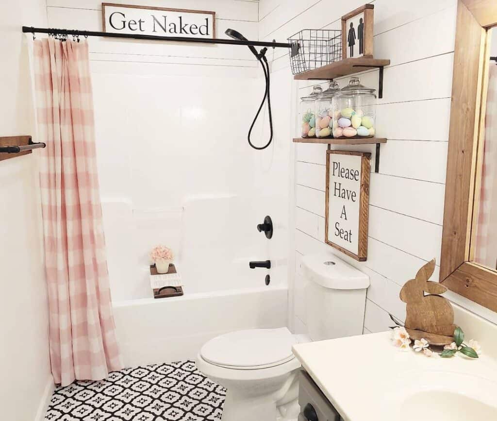White Bathroom with Pink Striped Shower Curtain
