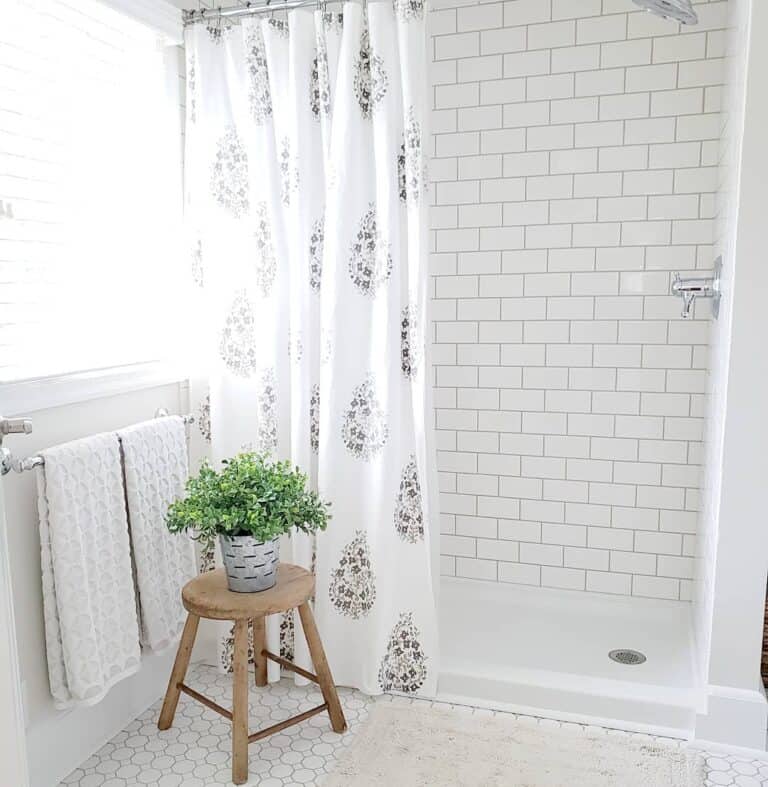 White Subway Tile Shower with Patterned Curtain