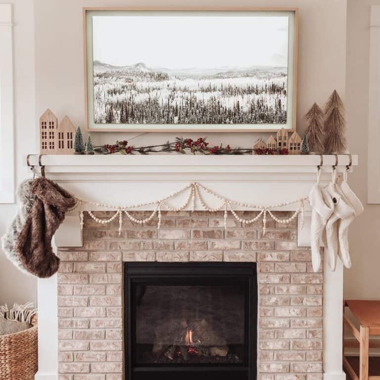 Whitewashed Brick Fireplace with Black and White Art