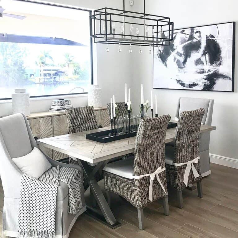 Wicker Chairs in Farmhouse Dining Room with Gray Walls