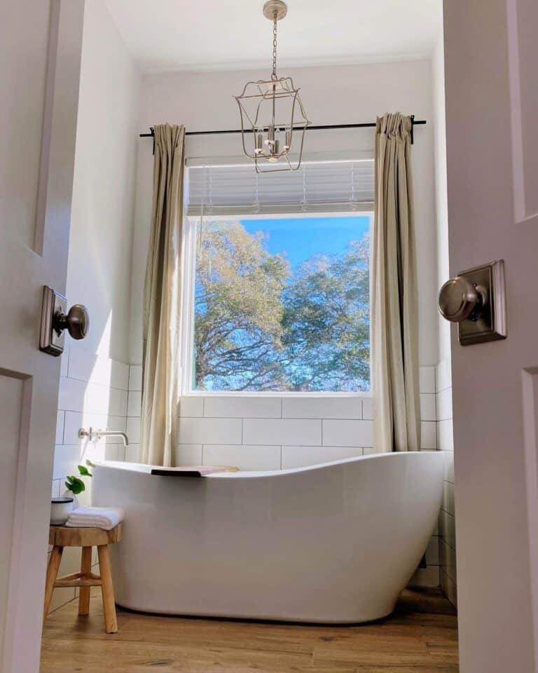 Window with White Blinds and Beige Curtains