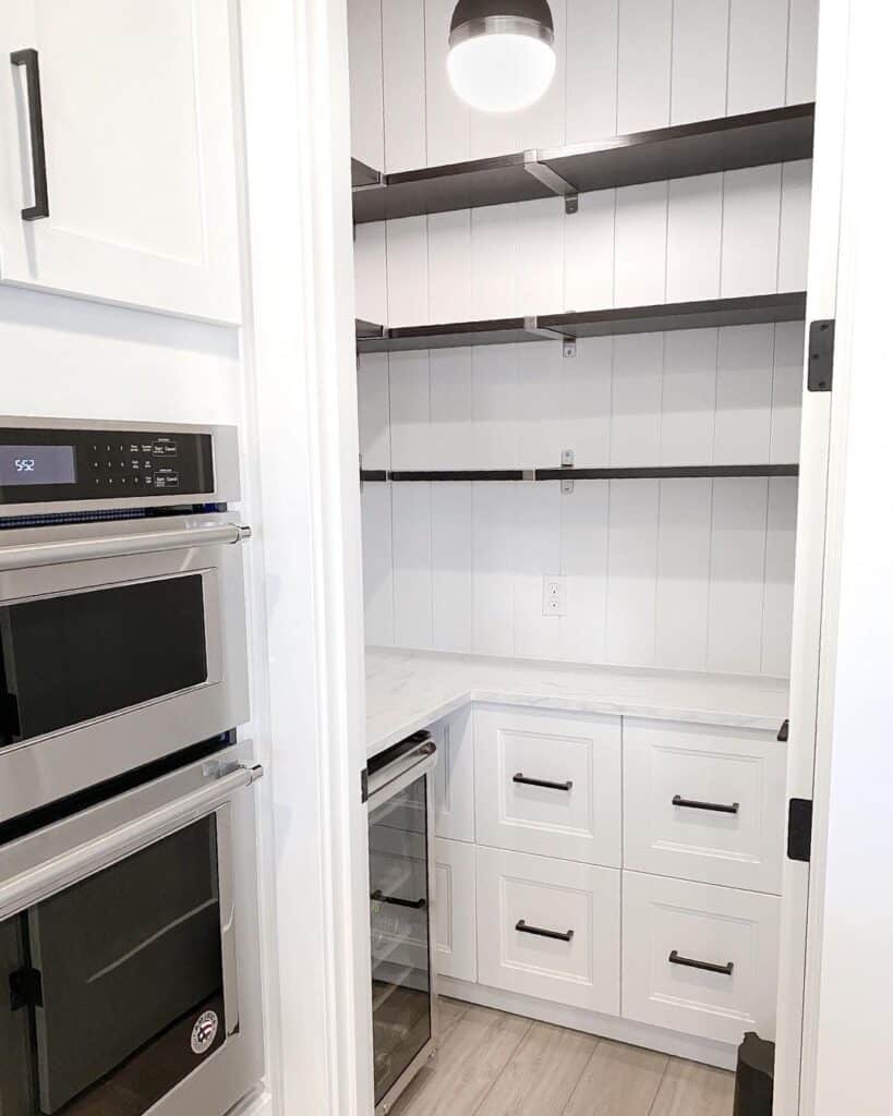 Dark Wood Shelves in Vertical Shiplap Pantry