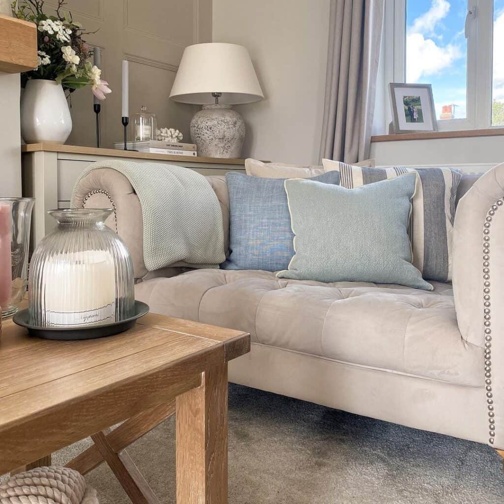 Beige Chesterfield Sofa with Wood Table