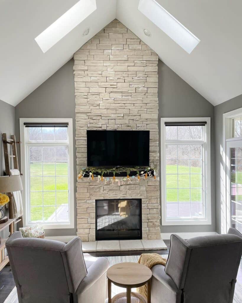 Beige Dry Stack Stone Floor to Ceiling Fireplace