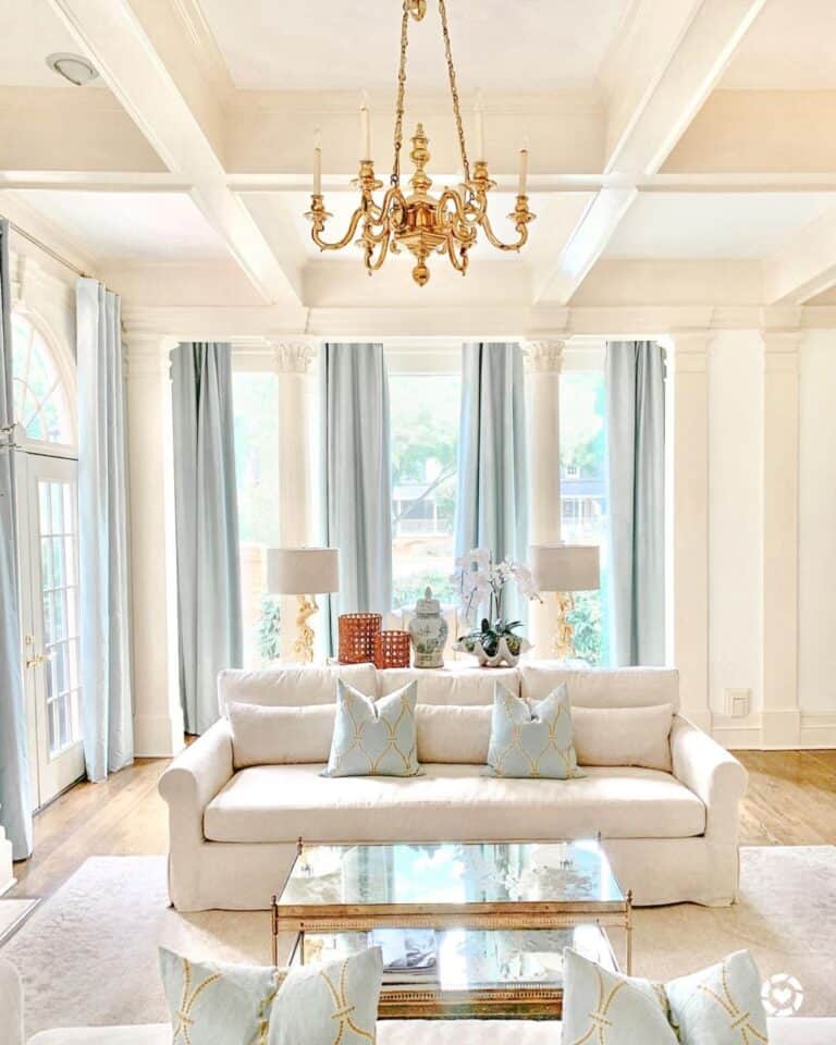 Beige Slipcovered Sofa with Gold Coffee Table